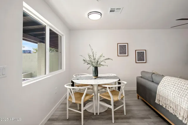 a dining room with furniture and window