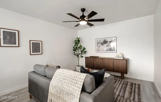 a living room with furniture and a window