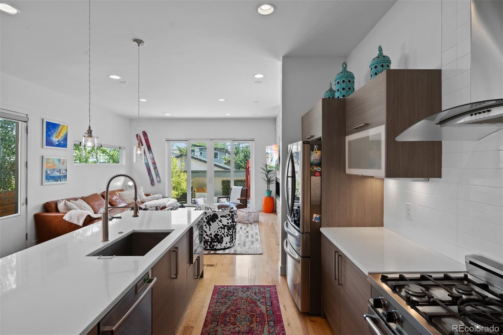 3632 North Pecos Street Denver, CO 80211 - Photo 14 of 47 a kitchen that has a sink and a stove