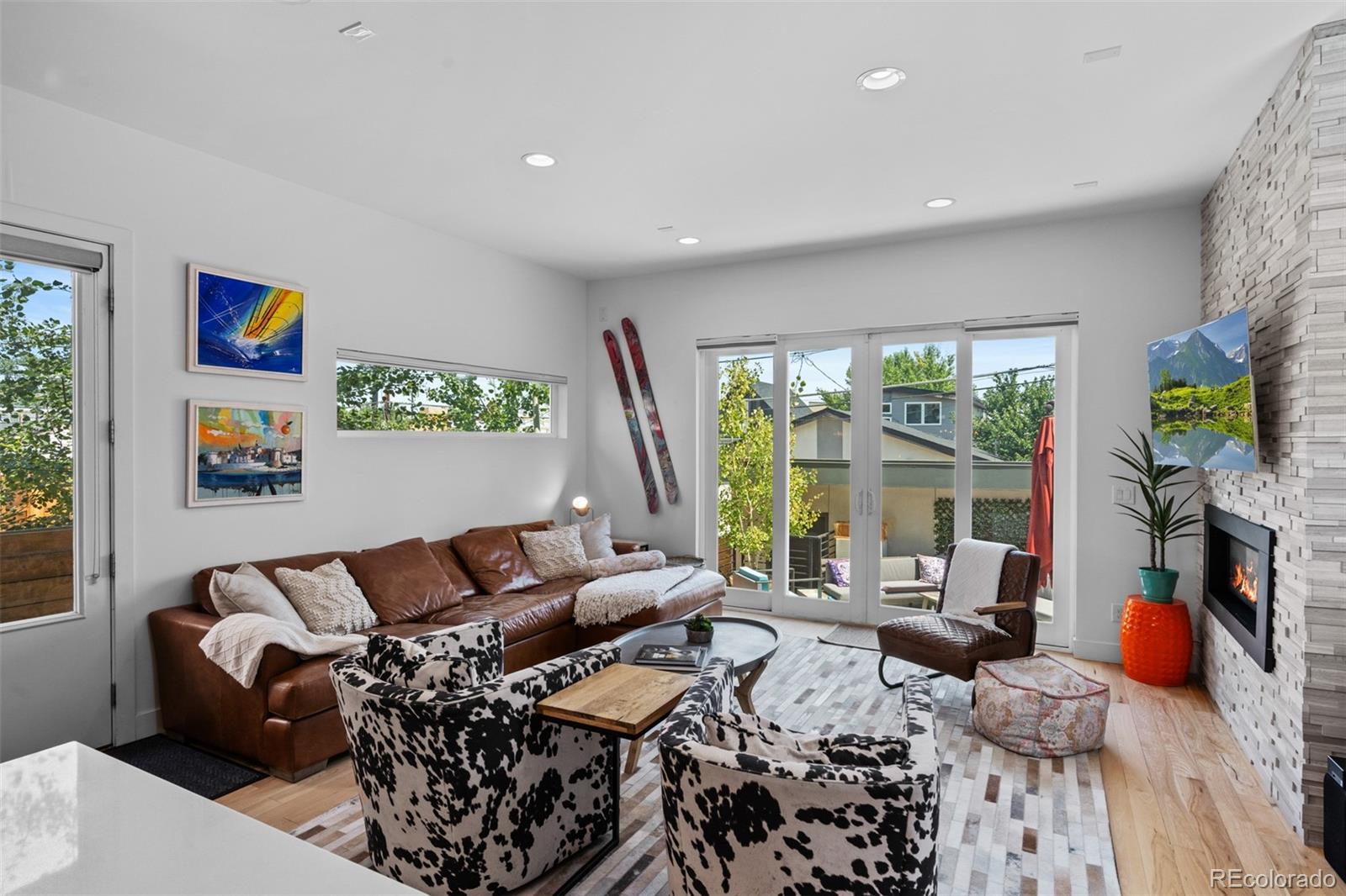 3632 North Pecos Street Denver, CO 80211 - Photo 16 of 47 a living room with furniture large window and a flat screen tv