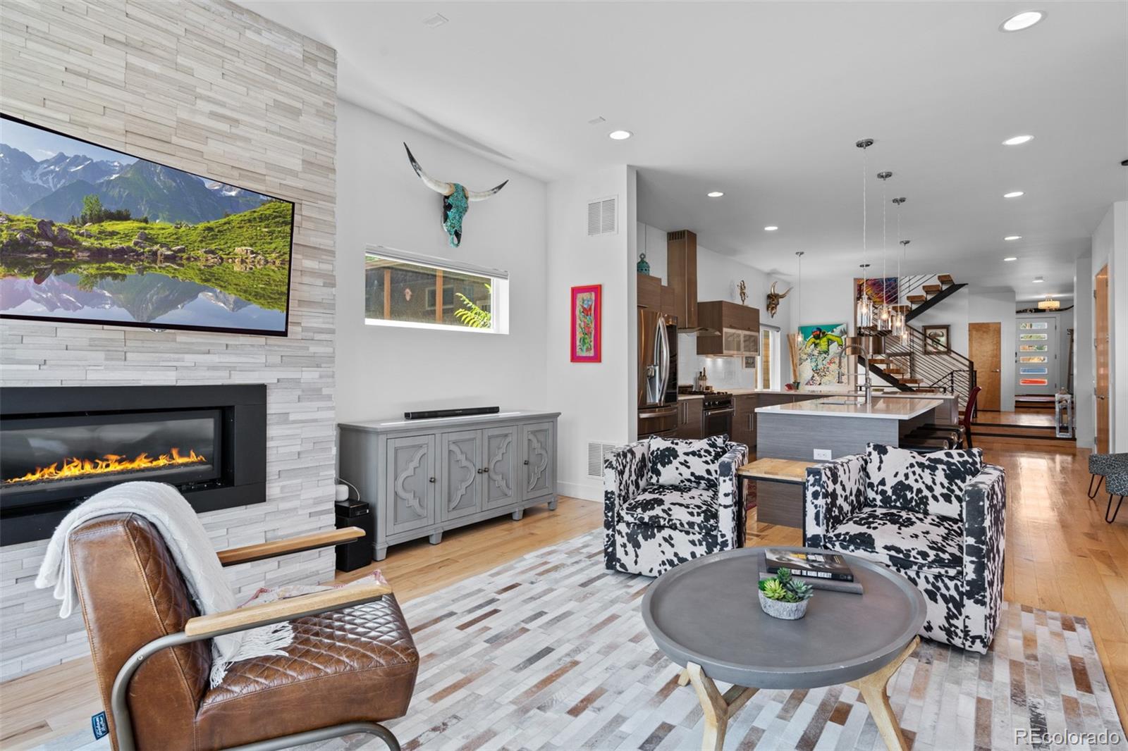 3632 North Pecos Street Denver, CO 80211 - Photo 17 of 47 a living room with furniture and a fireplace