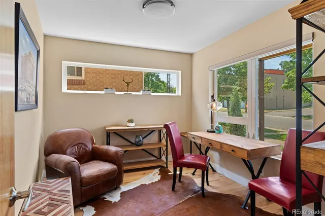 a view of balcony with furniture and wooden floor