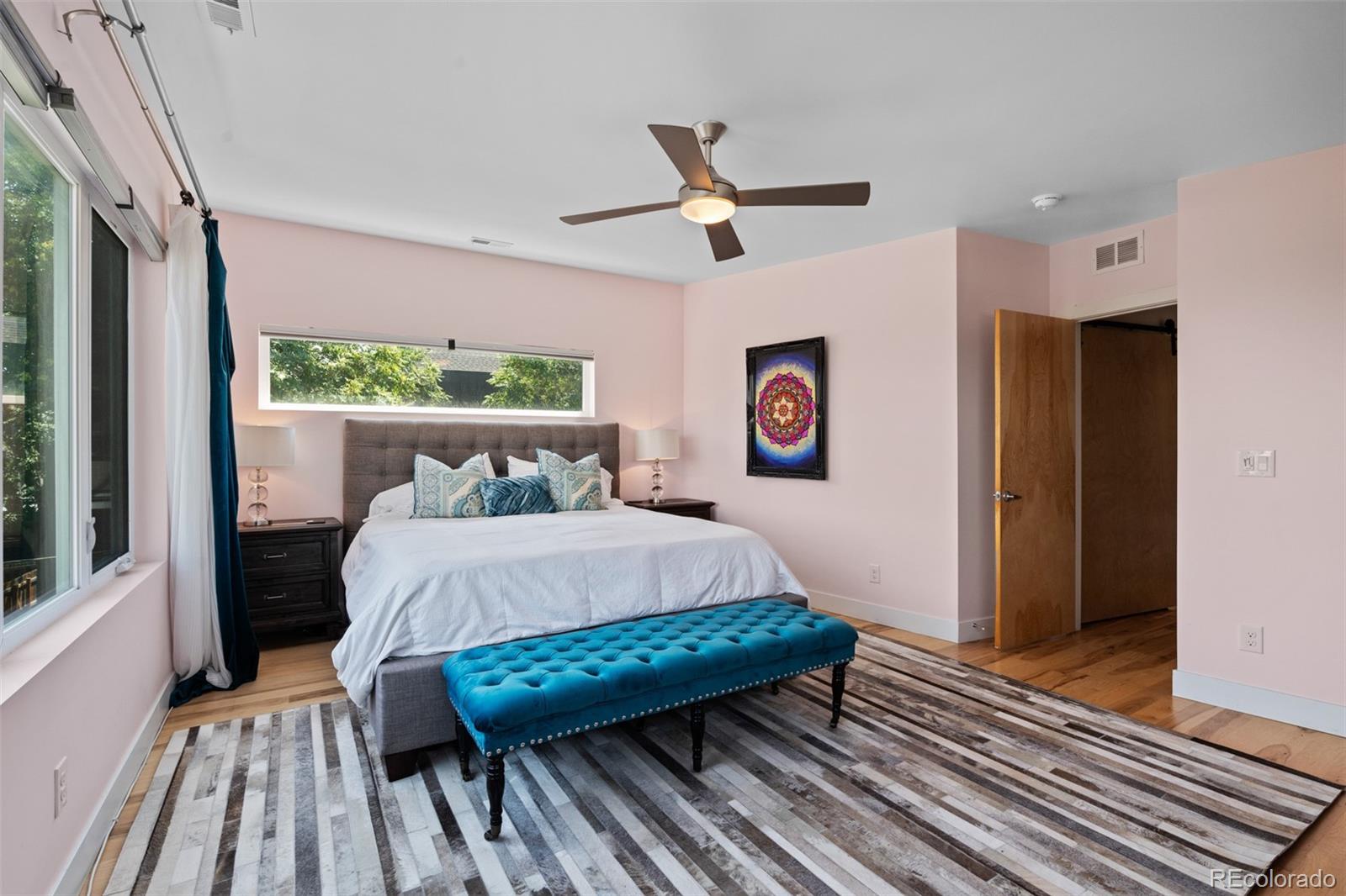 3632 North Pecos Street Denver, CO 80211 - Photo 24 of 47 a bed sitting in a bedroom next to a window