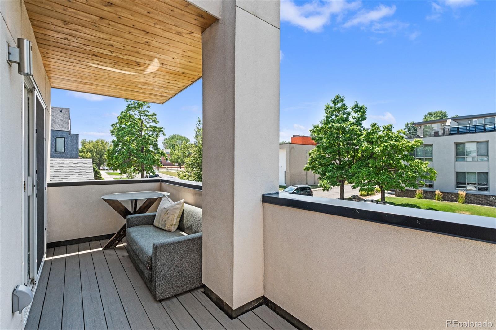 3632 North Pecos Street Denver, CO 80211 - Photo 30 of 47 a view of balcony with furniture and wooden floor