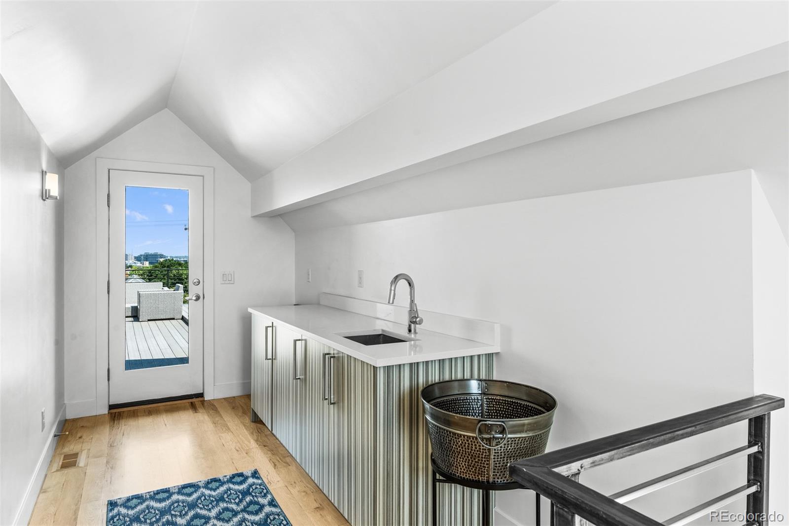 3632 North Pecos Street Denver, CO 80211 - Photo 34 of 47 a kitchen with a sink and a stove