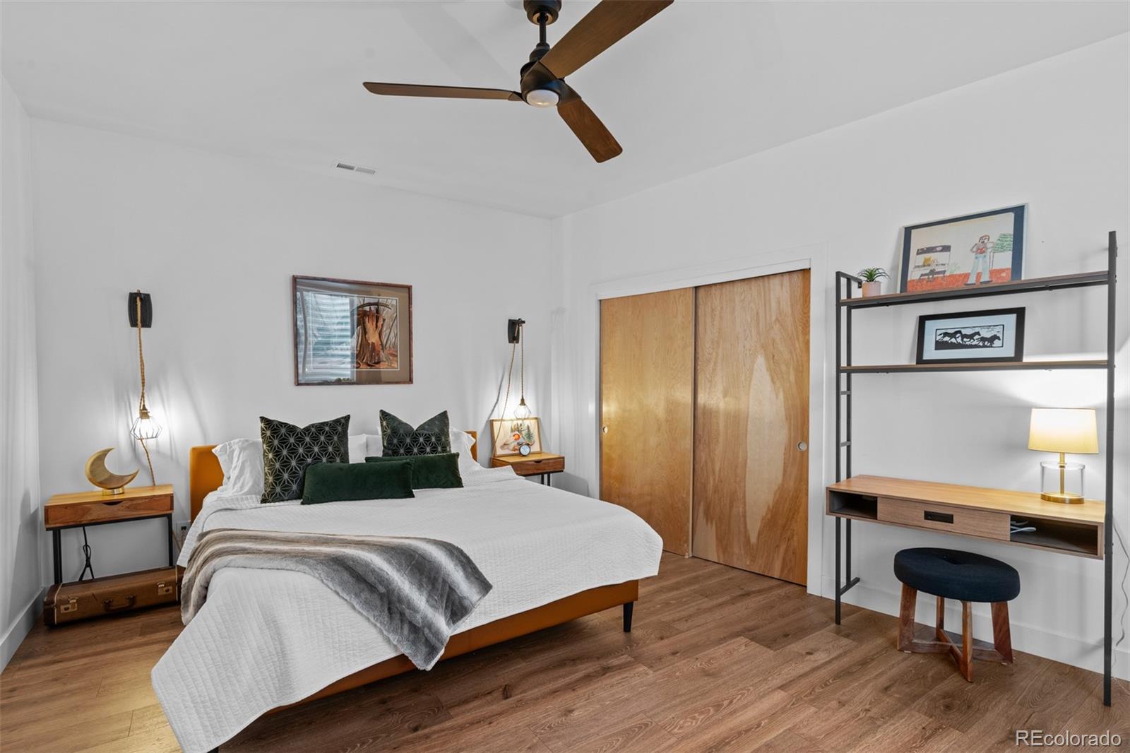 3632 North Pecos Street Denver, CO 80211 - Photo 42 of 47 a bedroom with a bed and a chair