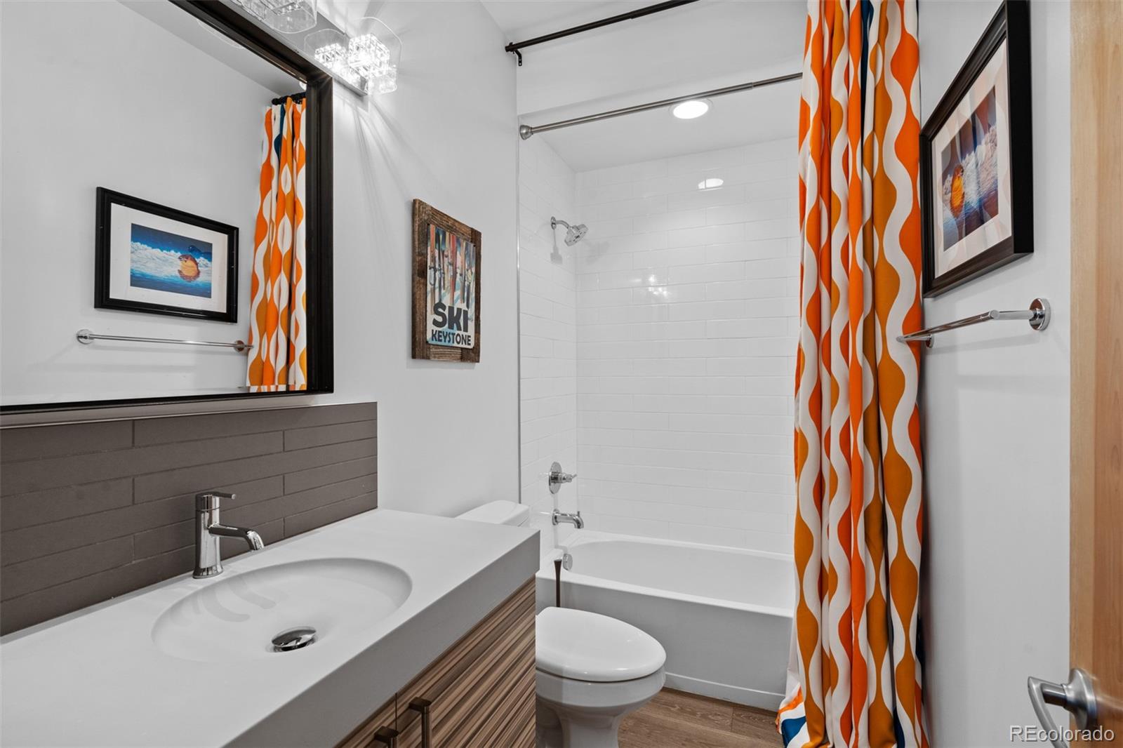 3632 North Pecos Street Denver, CO 80211 - Photo 44 of 47 a bathroom with a sink a toilet and shower