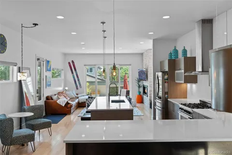 a kitchen with a table chairs stove and cabinets