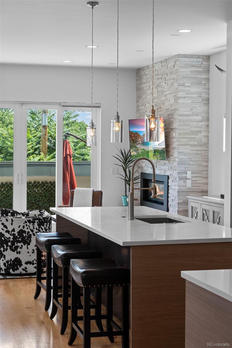 3632 North Pecos Street Denver, CO 80211 - Photo 8 of 47 a kitchen with a table chairs stove and cabinets