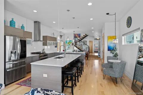 a living room with furniture fireplace and window