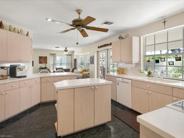 a kitchen with counter top space cabinets and appliances
