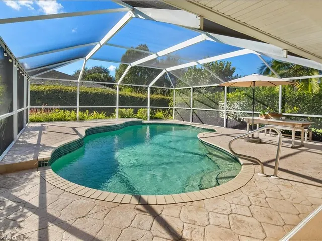 a view of a swimming pool with a patio
