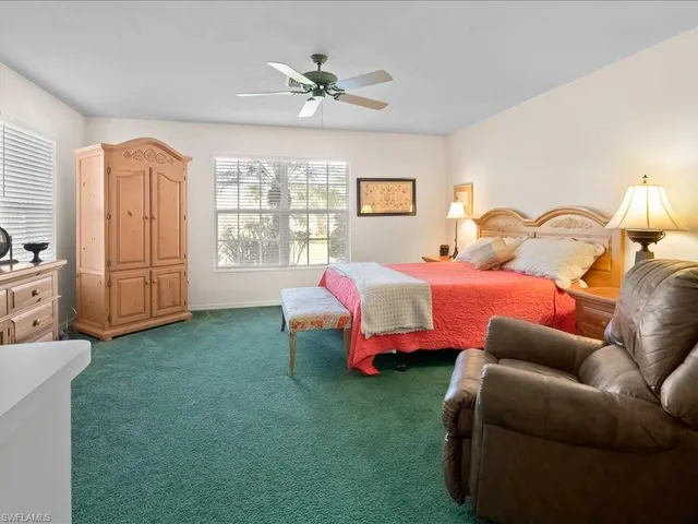 a bedroom with furniture and a window