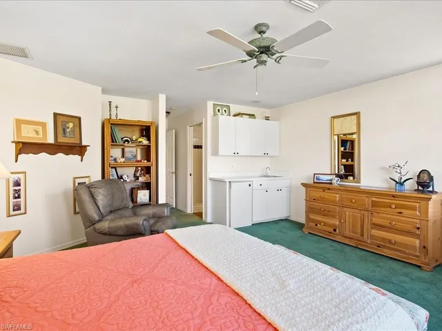 a bed room with a bed and a couch