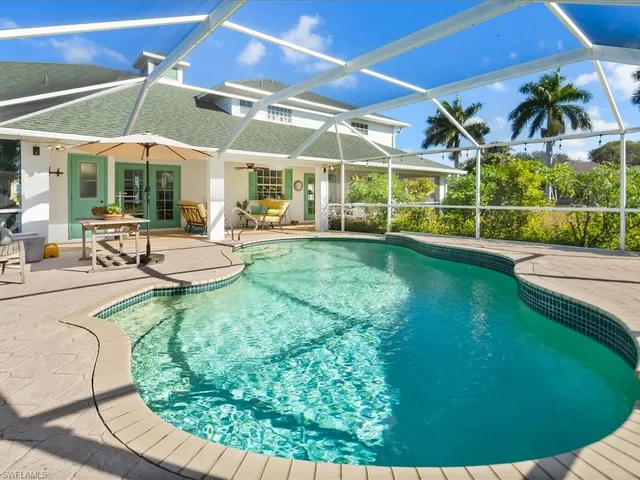 a view of a swimming pool with a patio