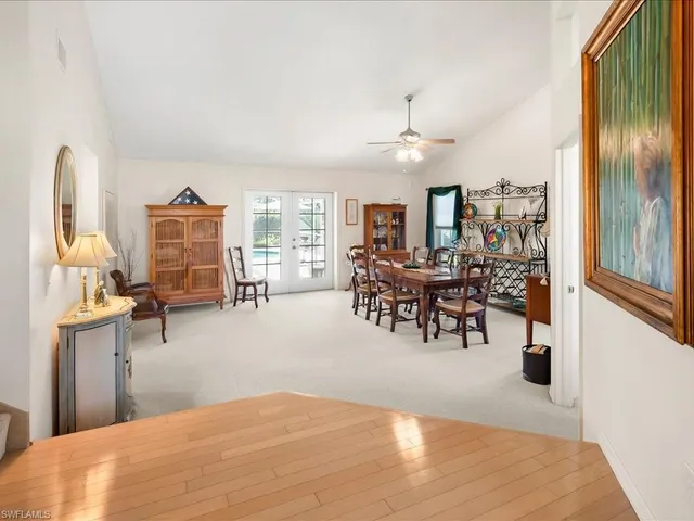 a bedroom with furniture and a chandelier