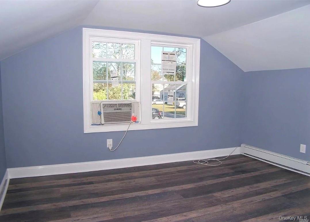 15 Ivy Road Mastic Beach, NY 11951 - Photo 12 of 24 a view of a room with wooden floor and windows
