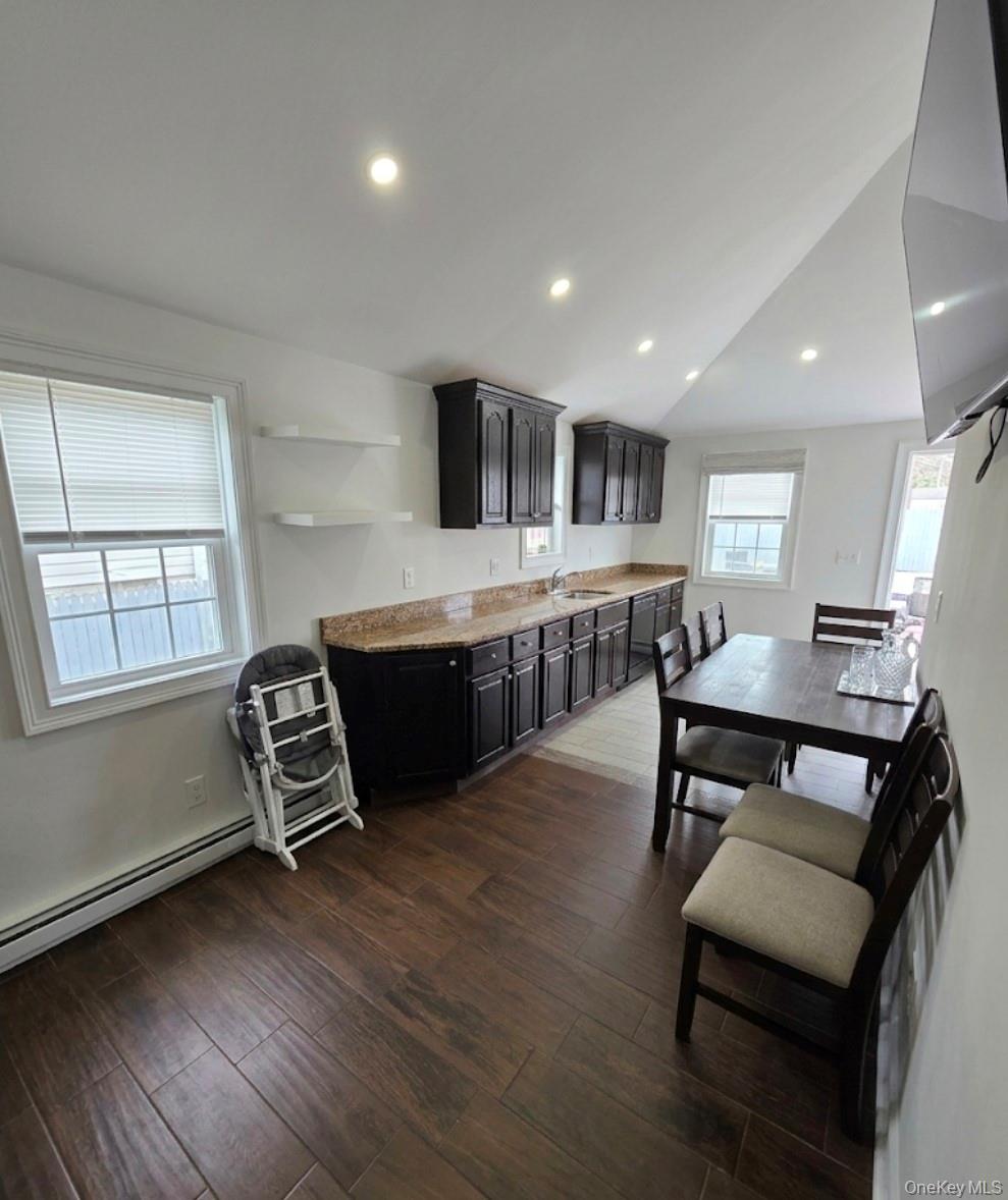 15 Ivy Road Mastic Beach, NY 11951 - Photo 16 of 24 a living room with furniture and a wooden floor