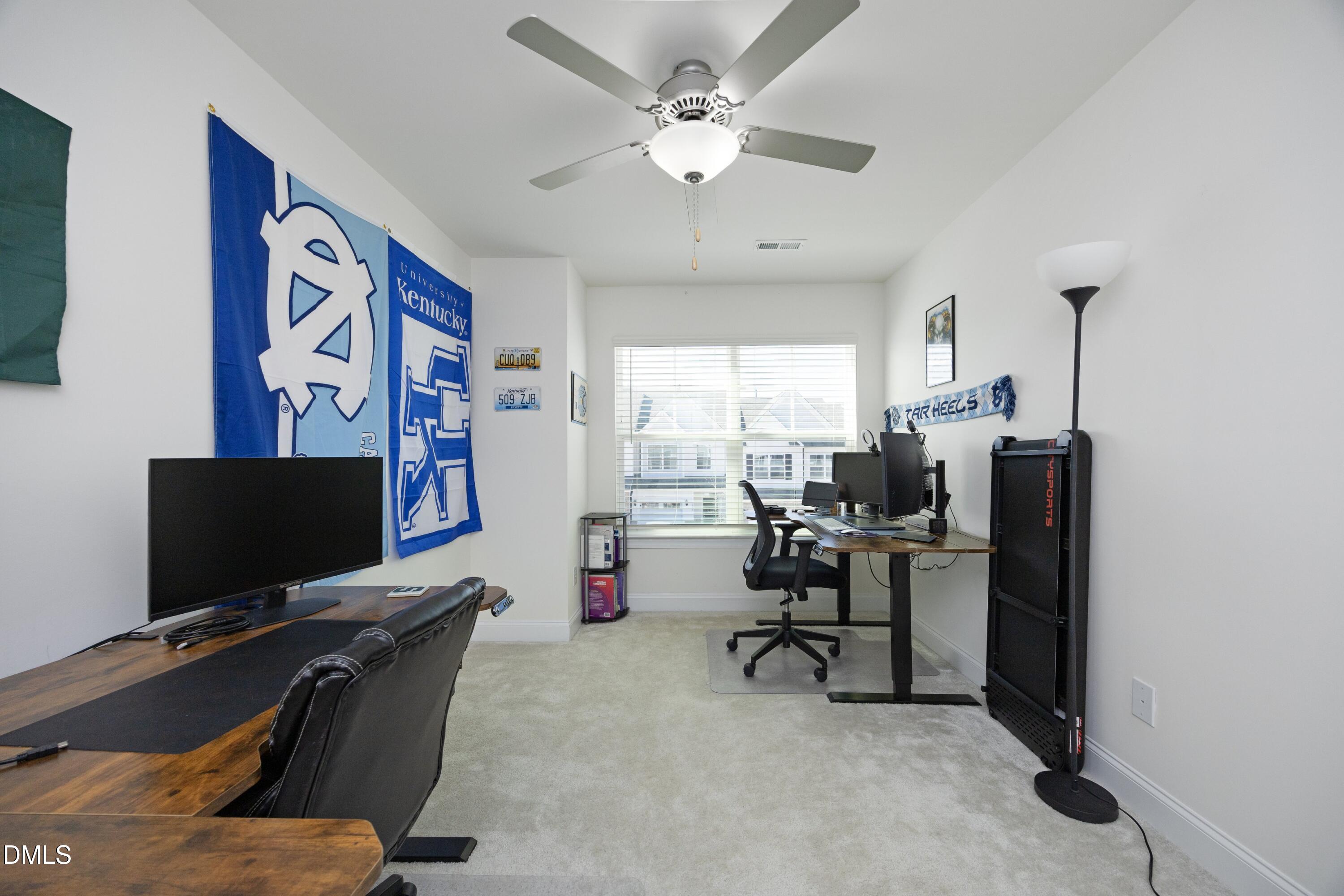 1002 Heartstone Way Durham, NC 27713 - Photo 21 of 35 a view of a workspace with furniture and a window