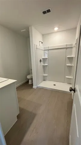 a view of an empty room and a window