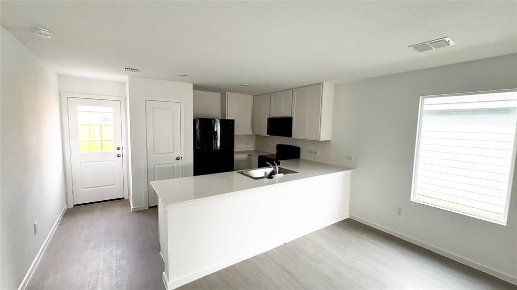 406 Bower Drive Princeton, TX 75407 - Photo 2 of 9 a room with a bed and a window