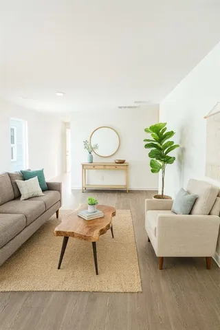 a living room with furniture and a rug