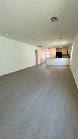 a view of a big room with wooden floor