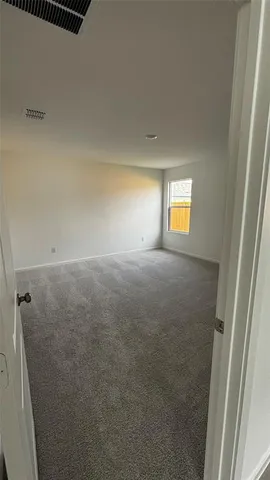 a view of empty room with windows