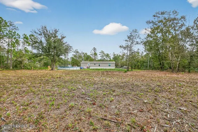 a view of outdoor space and yard