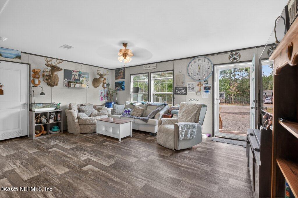 10545 Baylor Avenue Hastings, FL 32145 - Photo 5 of 17 a living room with furniture and a flat screen tv
