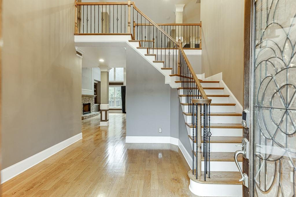 940 Chateau Forest Road Hoschton, GA 30548 - Photo 4 of 87 a view of entryway and hall with wooden floor
