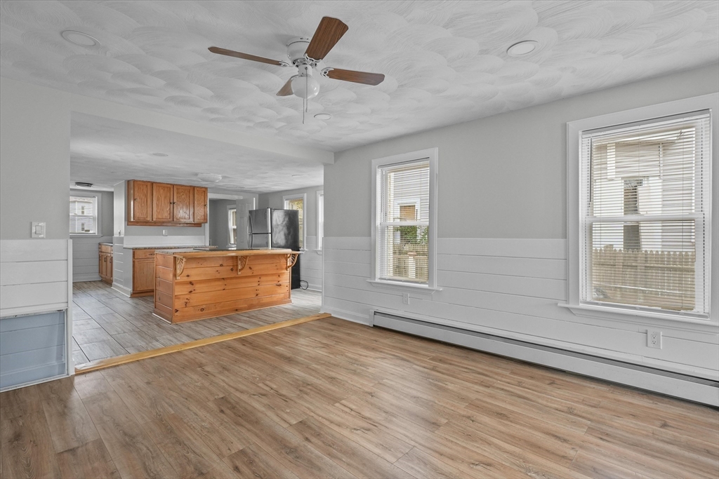 134 High Street Haverhill, MA 01832 - Photo 11 of 31 a view of an empty room with a window and wooden floor