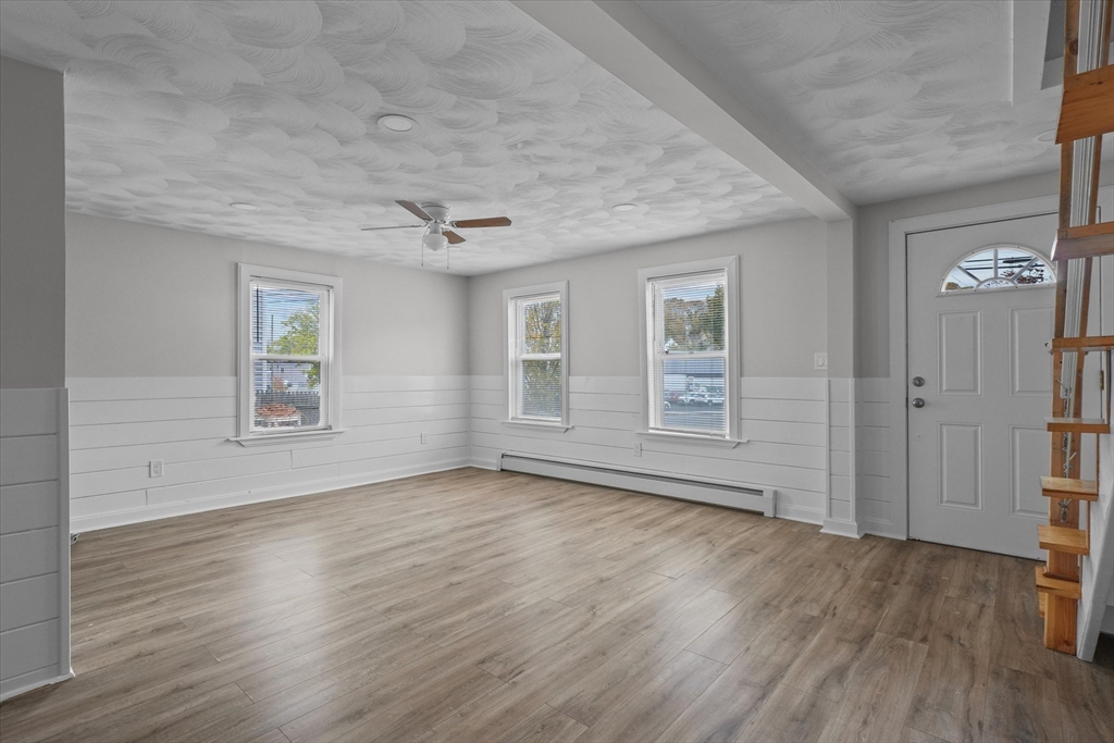 134 High Street Haverhill, MA 01832 - Photo 14 of 31 an empty room with wooden floor and windows