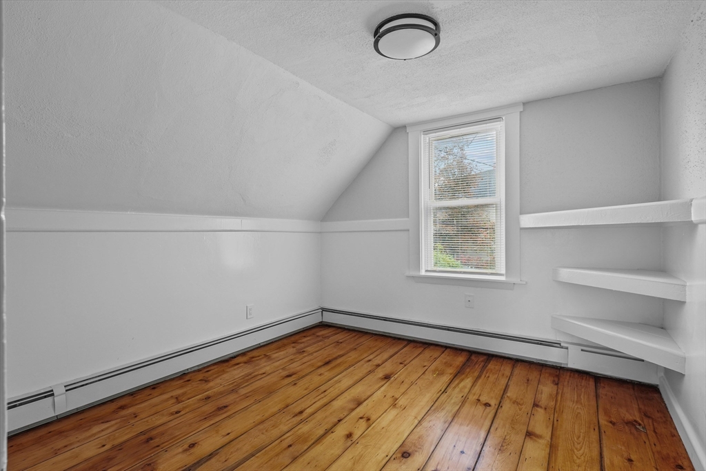 134 High Street Haverhill, MA 01832 - Photo 17 of 31 a view of a room with wooden floor and window