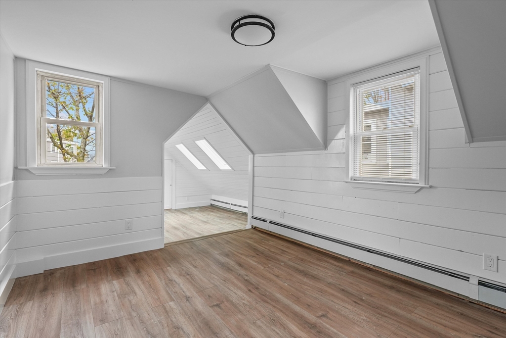 134 High Street Haverhill, MA 01832 - Photo 18 of 31 a view of empty room with wooden floor and fan