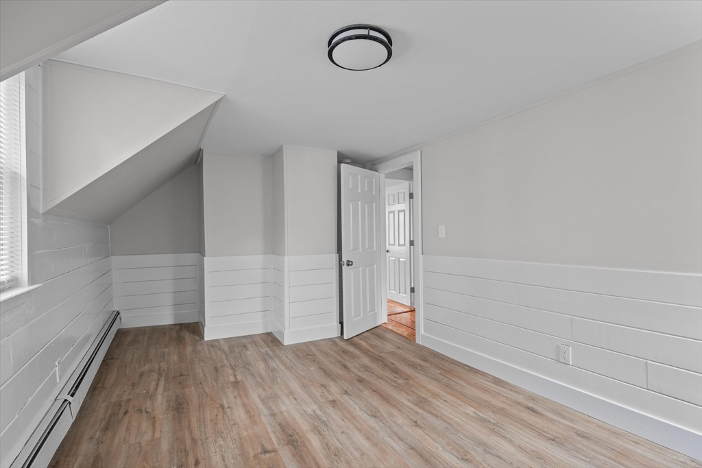 134 High Street Haverhill, MA 01832 - Photo 19 of 31 a view of room with wooden floor and window