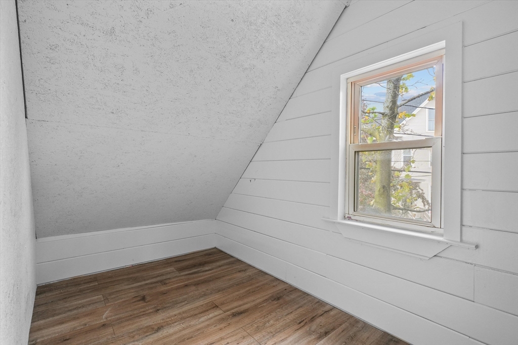 134 High Street Haverhill, MA 01832 - Photo 22 of 31 an empty room with wooden floor and windows