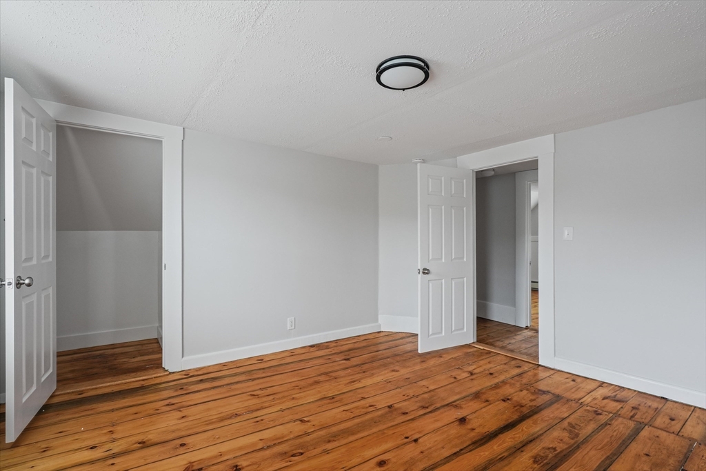 134 High Street Haverhill, MA 01832 - Photo 25 of 31 a view of a room with wooden floor and bathroom