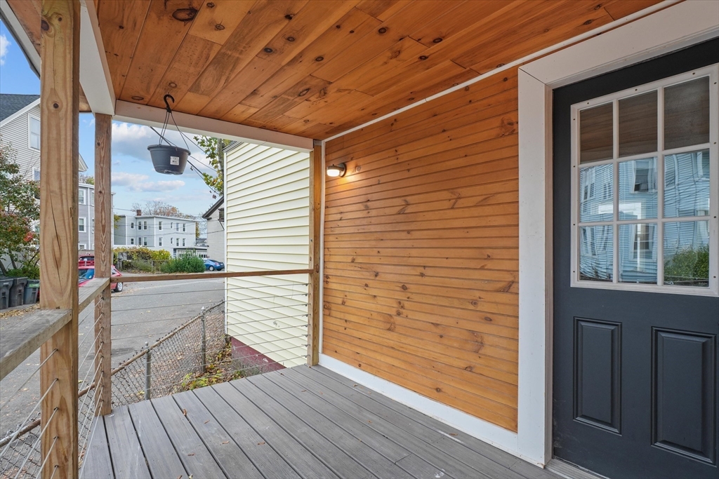 134 High Street Haverhill, MA 01832 - Photo 27 of 31 a view of a balcony with wooden floor and floor to ceiling window