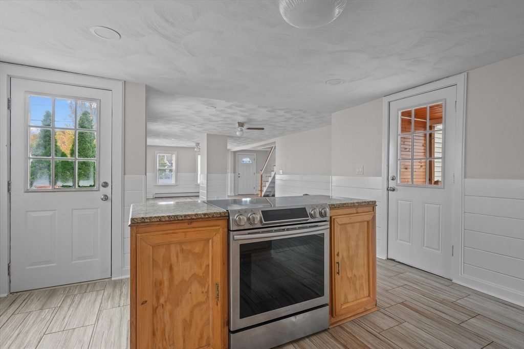 134 High Street Haverhill, MA 01832 - Photo 6 of 31 a kitchen with a stove and a microwave