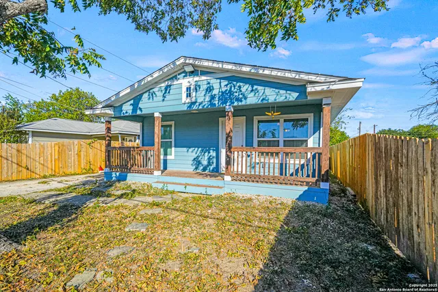 front view of a house with a large yard