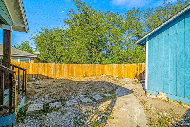 a view of a back yard of the house