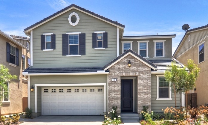 a front view of a house with garage