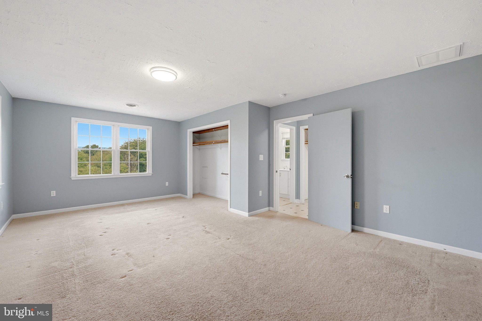 852 McDonald Road Winchester, VA 22602 - Photo 19 of 59 Primary bedroom is spacious and has a nice view