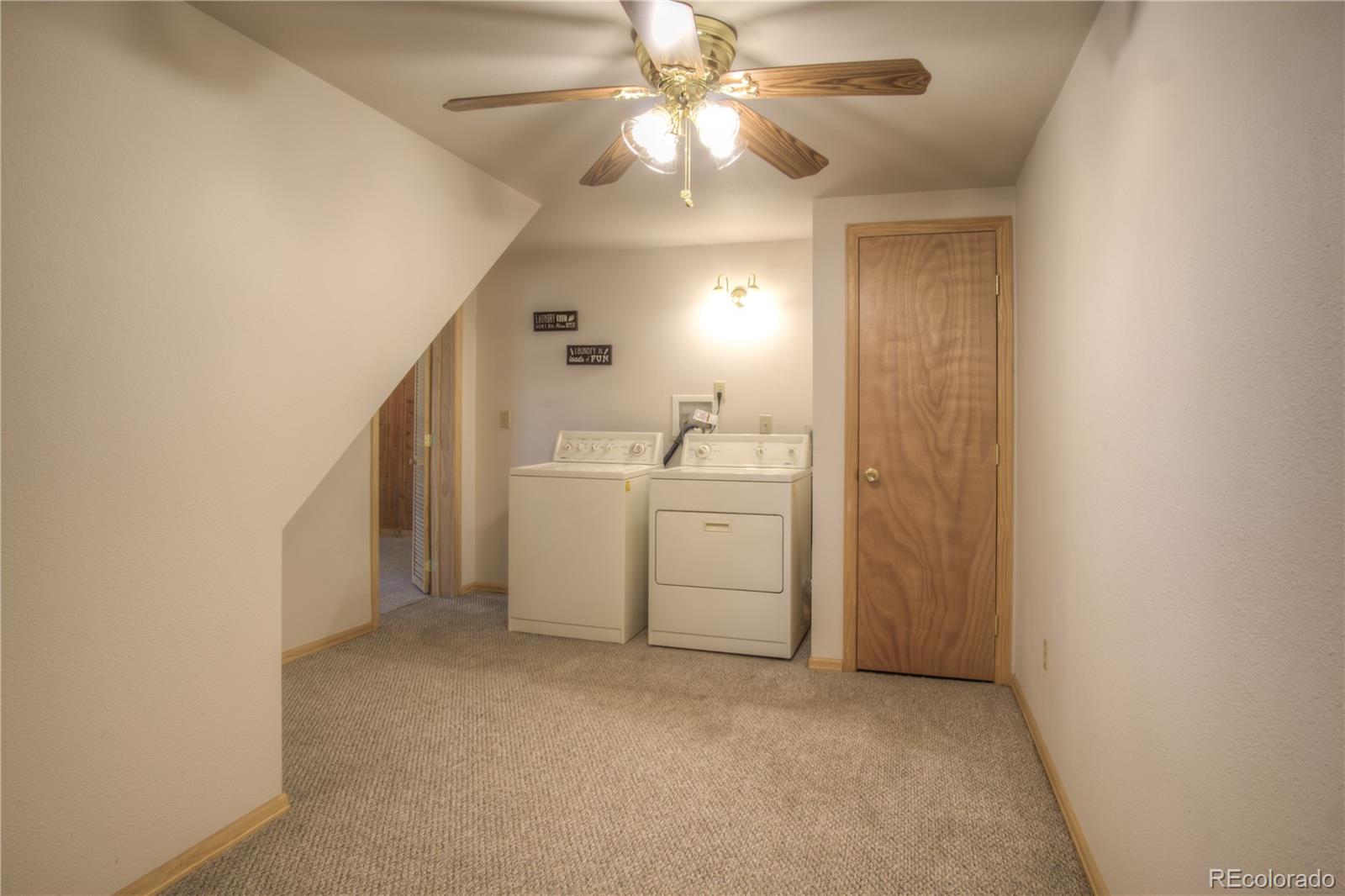 253 Raven Drive Bailey, CO 80421 - Photo 25 of 40 a view of a utility room with closet and cabinet