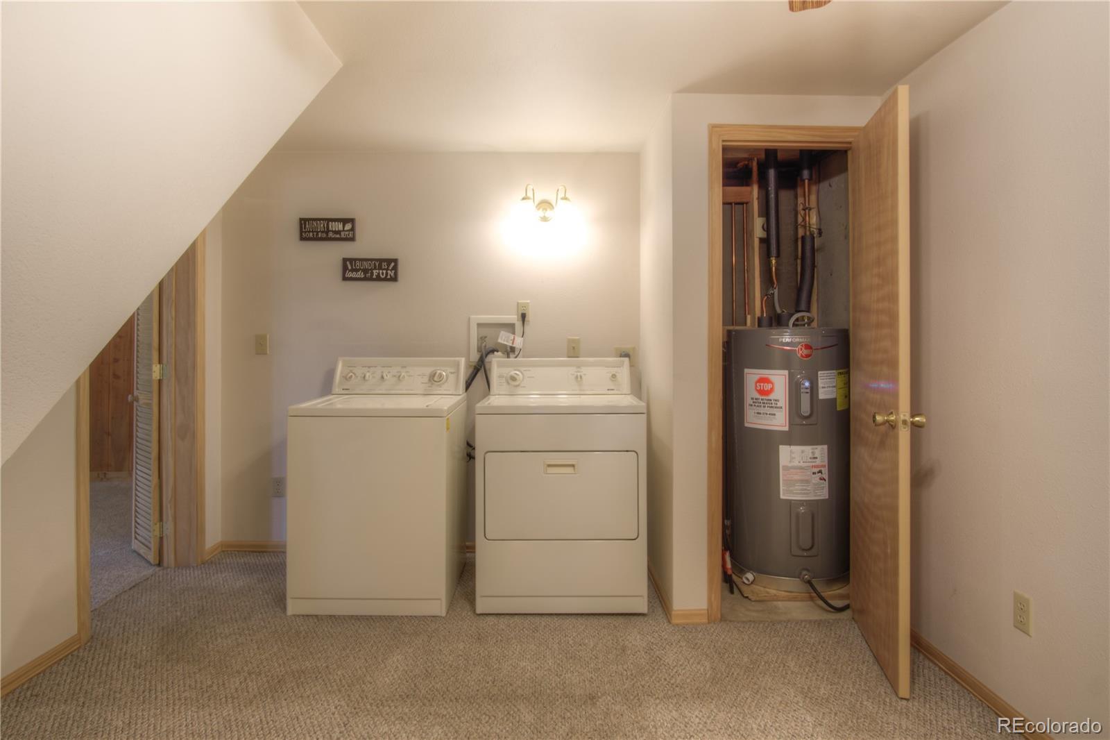 253 Raven Drive Bailey, CO 80421 - Photo 26 of 40 a utility room with dryer and washer