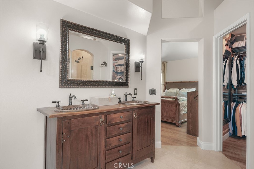 19066 Willow Brook Lane Lake Forest, CA 92679 - Photo 30 of 41 a en suite bathroom with a double vanity sink and a mirror