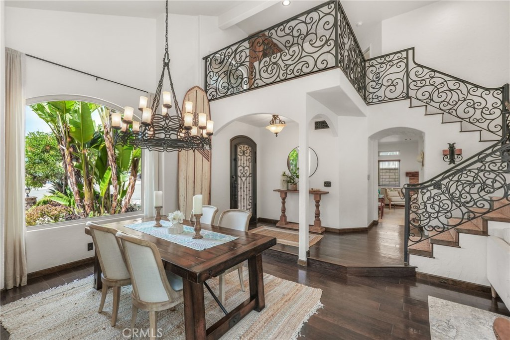 19066 Willow Brook Lane Lake Forest, CA 92679 - Photo 10 of 41 a view of a dining room with furniture a chandelier and large windows