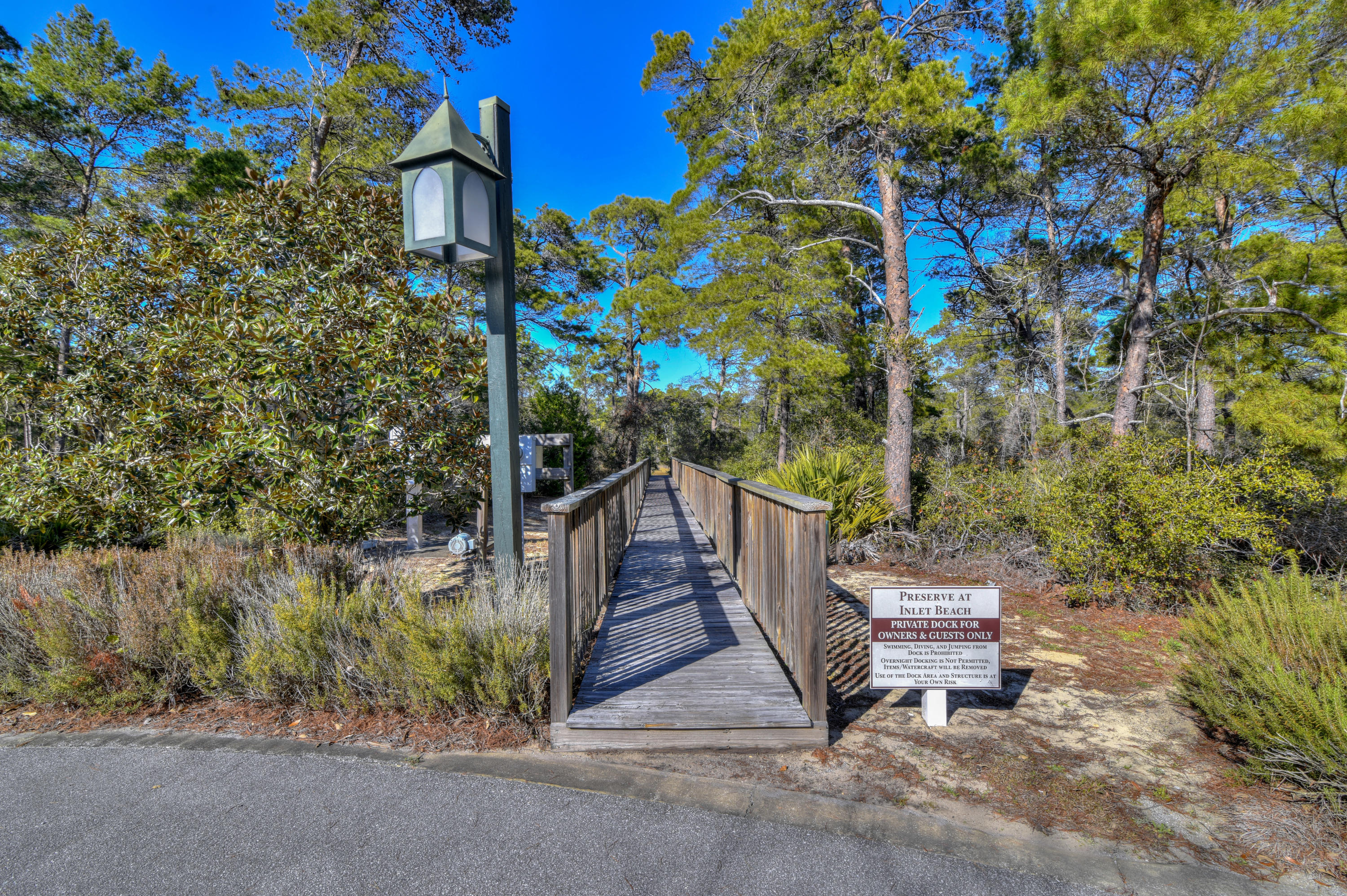 32 West Willow Mist Rd Inlet Beach Inlet Beach, FL 32461 - Photo 28 of 55 a pathway of a house with a yard and wooden fence