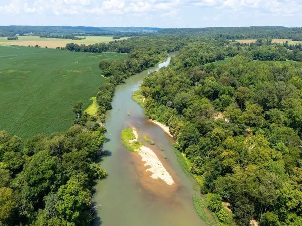 a view of a lake with a yard